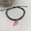 Schwarze Rocailles auf Nylonband mit rosegold glänzendem Blatt-Anhänger Armband Blättchen - schwarz, rosegold