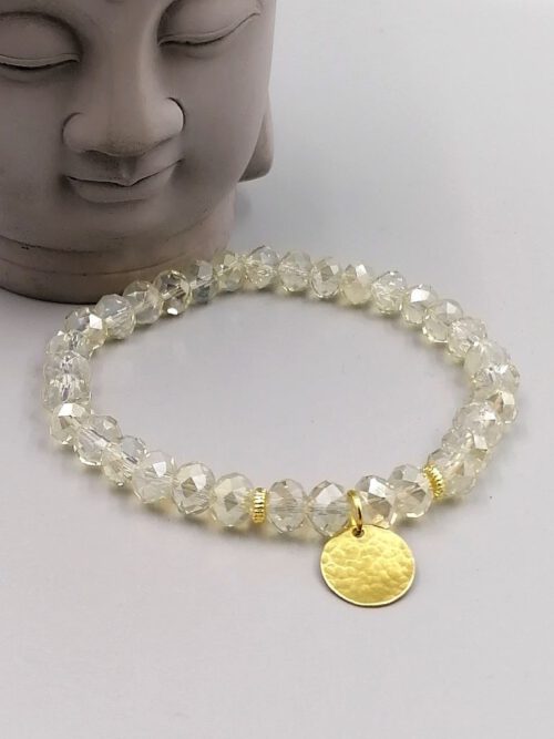 Kristallarmband-mit-vergoldeten-Spacern-und-Messing-Anhaenger