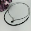 Schwarze Kette mit facettierten Kristallen