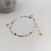 Buntes Boho Armband mit Herzanhänger