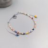 Buntes Boho Armband mit Herzanhänger