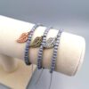 Graues Rocailles-Armband mit bronze Blatt