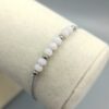 Textilarmband mit rosa Kristallperlen