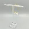 Goldfarbene Creolen mit Bergkristall