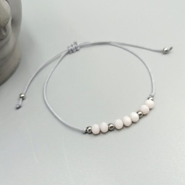 Textilarmband mit rosa Kristallperlen