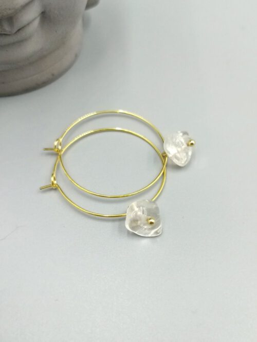 Goldfarbene Creolen mit Bergkristall
