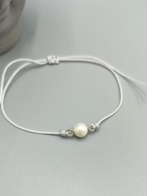 Textilarmband mit weißer Muschelkernperle