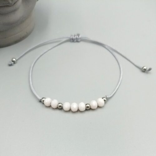 Textilarmband mit rosa Kristallperlen