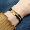 Geschenkidee: Armband mit Symbol für ewige Liebe Infinity Armband Makramee schwarz gold