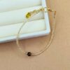 Goldenes Rocailles-Armband mit Tigerauge