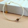 Goldenes Rocailles-Armband mit Tigerauge
