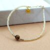 Goldenes Rocailles-Armband mit Tigerauge